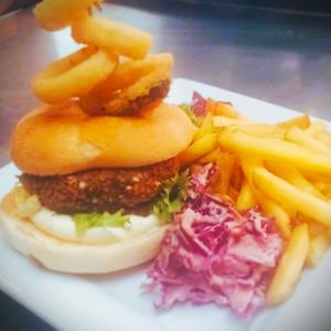 Vegan Aromatic Garden Burger, Home-made Red Slaw, Fried Dill pickles, Onion rings, skin on fries at The George Inn in Braunton