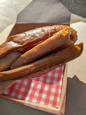 Pretzel bun with vegan sausage at The Lift Cafe in Folkestone