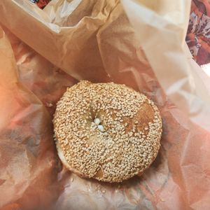 Sesame seed bagel with vegan butter.  Bakery is in house! at Gemini Cafe & Bakery in Bethel