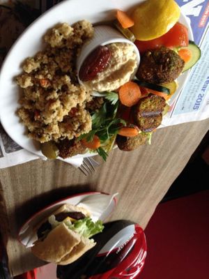 Two of the recent specials. Vegan delight salad (felafel, hummus, couscous, veggies, olives, pickles, lemon & a date) and vegan cheeze burger. Both excellent.  at CB1 Internet Cafe in Cambridge