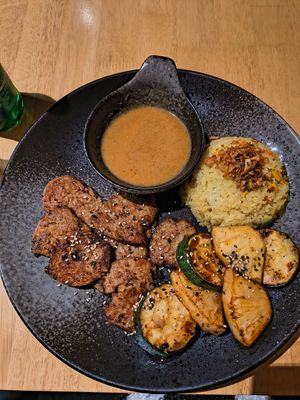 Happy grillteller (vegan meat, rice, homemade sauce, grilled Zucchini and pineapple) at AnTee Vegan in Hamburg