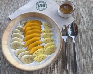 Yellow fruit bowl (granola being removed and cashew yogurt added by a request)  at Woo Phuket in Phuket