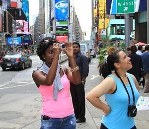 Taking photos in times square at NYC Vegan Vacations in New York City