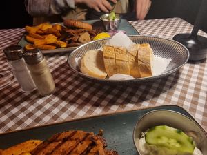 Mixed grill with French fries and bread at Taverna Athene in Berlin