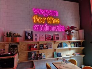 Vegan for the animals sign and book shelves. at Full Soul Vegan in Stockholm