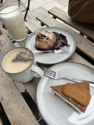 CBD latte, tea, blueberry bun with white chocolate frosting and biscoff cheesecake  at Full Soul Vegan in Stockholm