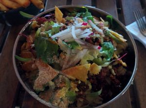 Nacho chorizo Mac & Cheese; house made seitan chorizo, smoked cashew cheese, pickled jalapeños, nacho crumbles, cilantro at Hella Vegan Eats in Oakland