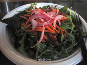 Salad with this really tasty tempeh topping and lemony vinaigrette. Mmmmm... at Hella Vegan Eats in Oakland