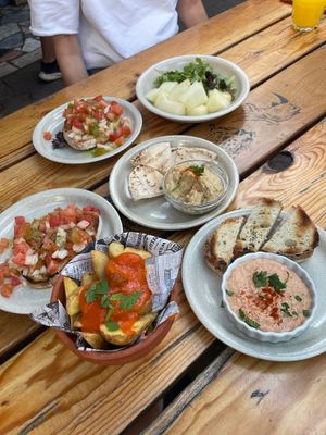 Vegan starters; bruschetta, hummus, melon, patatas bravas   at The Garden  in Lagos