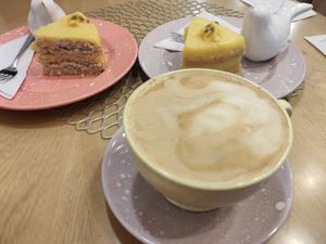Coconut cappuccino and vegan passion fruit cake at Bakery Bites in Bogota