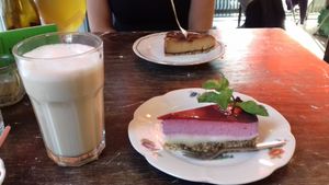 Vegan berry cheesecake in the front, with a soy chai latte. at Burgertrut in Rotterdam
