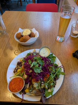 Vegan kapsalon (salad on top of fries with vegan sharma and vegan cheese), vegan bitterballen at Burgertrut in Rotterdam