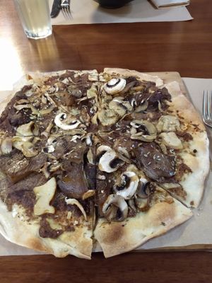 Pizza with mushroom baked in wood oven at Flores do Cabo in Colares