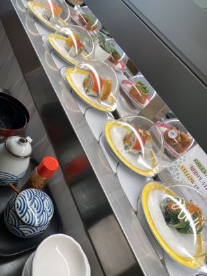 Sushi train offerings with vegan salmon   at Midori By Tao's   in Balwyn North