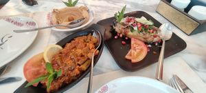 Okra, raheb salad and sunset hummua at Habib Beirut in Amman