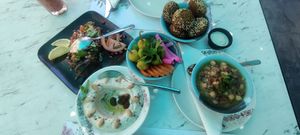 Breakfast mezze: foul, hummus beiruti, pickles, falafel, eggplant salad at Habib Beirut in Amman