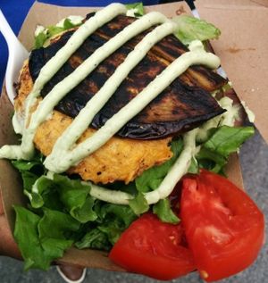 Bacon cheddar ranch salad; romaine & other lettuces topped with phatty beet burger, hickory smoked eggplant bacon, v-cheddar cheese, pickles, house made ranch. Delicious! at Chickpea & Olive in Brooklyn