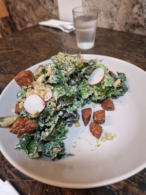 Kale salad, wild garlic dressing, fried tempeh, pickled wild garlic buds. at Higgs Field Restaurant in Kilkenny