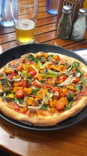 Big Island pizza without goat cheese (includes honey, but is otherwise vegan) at Hula Grill in Lahaina