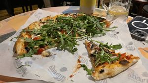 Sorry it’s half eaten. It was yummy! Mushroom and rocket with vegan cheese .  at Alfred's Pizzeria in Perth