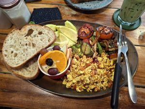 Vegan cooked breakfast (tofu scramble, mixed veg stir fry with roasted tomatoes, avocado, fresh homemade bread & fresh fruit. (It also comes with muesli but I opted out) at Lemon Thyme Cafe in Pai