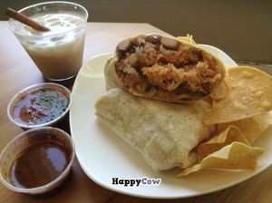 Salsa from salsa bar, vegan horchata, vegan burrito with soy beef. at Tacos Cancun in Costa Mesa