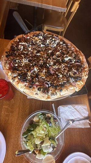 16” vegan pie with spicy tofu, onions, mushrooms, black olives, garlic   at Giovanni's Restaurant and Bar in Mammoth Lakes