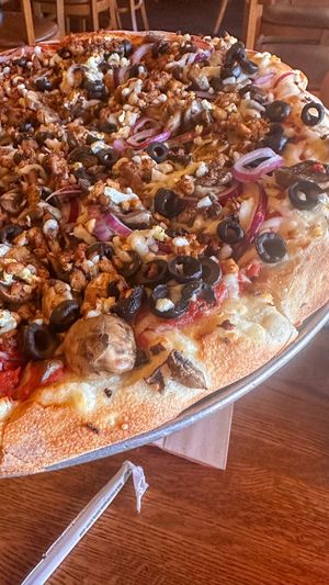 16” vegan pie with spicy tofu, onions, mushrooms, black olives, garlic   at Giovanni's Restaurant and Bar in Mammoth Lakes
