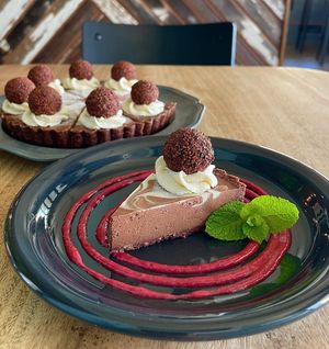 チョコレートタルト。トリュフも大粒！ラズベリーソースのデコレーションも美しい！  at Blue Point Falafel & Coffee in Yomitan