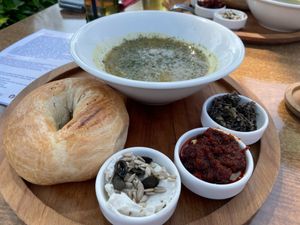 Lentil soup and bagel with different types of vegan toppings at Bagels & More in Ijsselstein