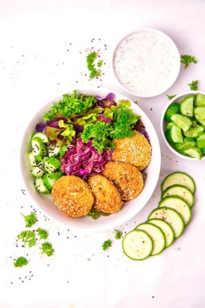 Falafel Bowl.
Falafel bowl -our special baked no oil falafel on the bed of fresh salad and creamy tzatziki sauce. Falafel, trio salad, cucumber, tzatziki sauce. at Dobro Top Vegan   in Dubai