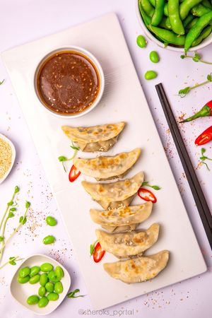 Edamames and Mushroom Gyoza.
Thin gyoza dough and mix of three mushrooms with edamame beans served with vegan cream sauce and teriyaki sauce. Gyoza dough, champignon, shiitake, .. at Dobro Top Vegan   in Dubai
