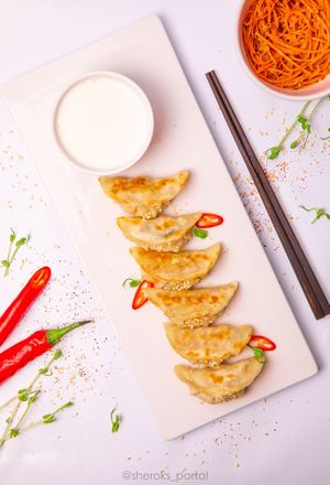 Tofu and Vegetables Gyoza.
Thin gyoza dough and mix of veggies and tofu served with vegan cream sauce and teriyaki sauce. Gyoza dough, tofu, carrot, chinese cabbage, spinach at Dobro Top Vegan   in Dubai