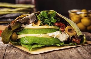 Pita Barcelona.
Antioxidant green pita with spinach stuffed with classic Italian mix of cheese and sun-dried tomatoes, layed on a bed of fresh greens.  at Dobro Top Vegan   in Dubai