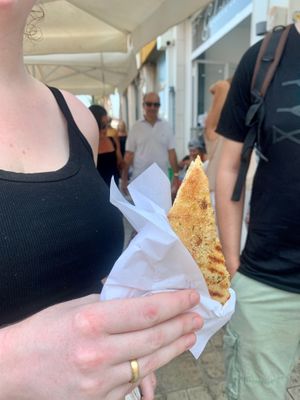 Lara trying the caponata pizzolo at Vegan Food Tour Ortigia in Siracusa