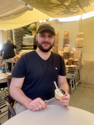 Deciding on his favorite flavor of gelato - April 2024 at Vegan Food Tour Ortigia in Siracusa