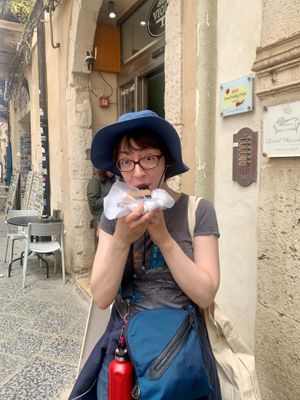 Rebecca enjoying the crostata - April 2024 at Vegan Food Tour Ortigia in Siracusa