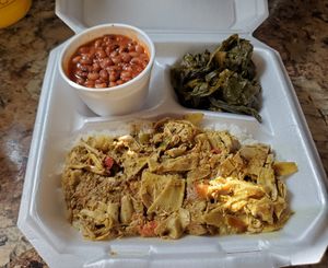 Coconut rice with banana blossom curry, black eyed pea stew, and collard greens at Afrobites in Little Rock