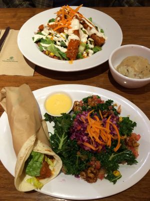Buffalo mini wrap and  former menu items - All Hail Kale salad, B wing salad and cauli mash. at Veggie Grill by Next Level - University Village in Seattle