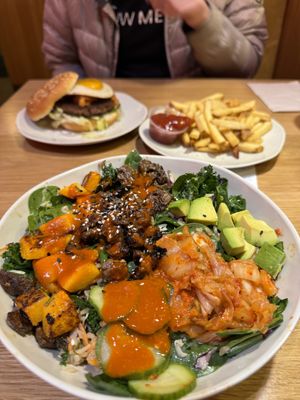 Kimchi steak bowl, kimchi burger and fries  at Veggie Grill by Next Level - University Village in Seattle