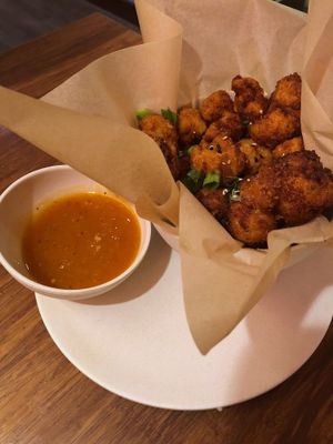 Crispy cauliflower with orange sauce  at Veggie Grill by Next Level - University Village in Seattle