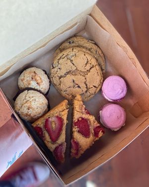 Bakery box with a variety of treats! Purple sweet potato powder gives the macarons the bright purple color 💜  at Heart Baker - Cloud Kitchen in Buena Vista