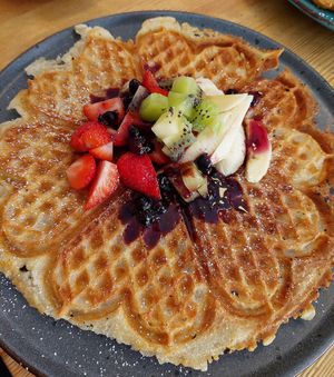 Vegan waffle with berries and fruit. at Leonardos Kafferosteri in Stockholm