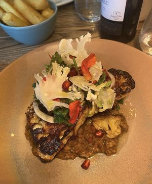 Cauliflower steak on a bed of spicy lentils   at Lovage  in Newcastle Upon Tyne