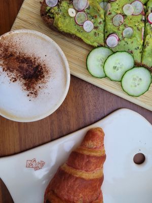 Had a vegan hibiscus croissant, avocado toast, and cappuccino with oat milk. Very tasty :) at Le Pain Quotidien - St. Honore in Paris