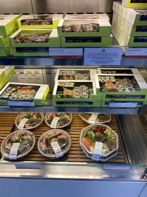 Vegan options on the middle row (clearly differentiated with green vegan labelling)  at Wasabi - Victoria Station in London