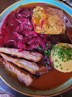 Crispy duck (left) and roulades (top right) with red cabbage, dark beer sauce and potato dumpling (had 2 shared plates) at DILL Vegan Gastronomie in Augsburg