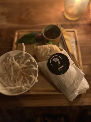 Bahn Mi but vegan. Not on the menu. Avacado, lettuce, tomatoes, peppers, onions. And a delicious sauce (vegan but definitely had lemongrass in it). Served with rice sticks.   at Mali Thai in Olon