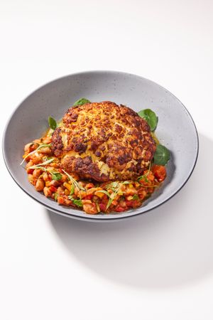 CHILI-ROASTED WHOLE CAULIFLOWER Heirloom Borlotti Bean Sofrito. Salsa Verde. Micro Cilantro. at Love.Life in Culver City