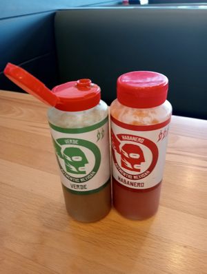 Hot sauces on tables at Mad Mex in Cameron Park